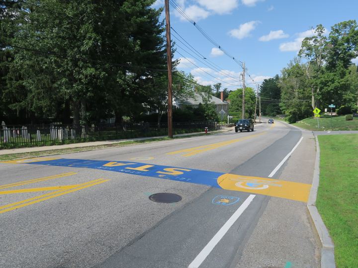 The Boston Marathon starting line painted on the road in Hopkinton, Massachusetts